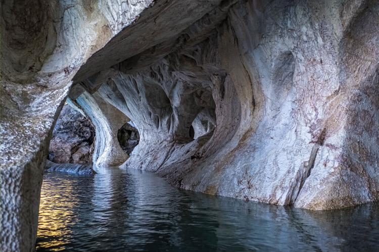Kayaking inside marble caves on General Carrera lake in Patagonia