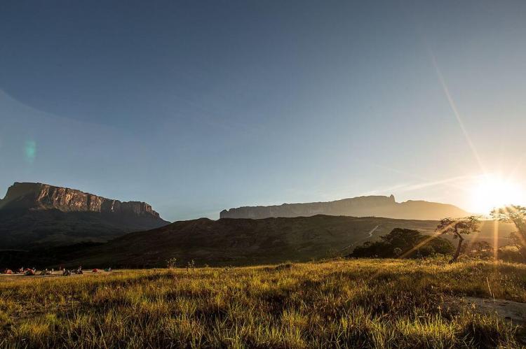 Mount Roraima and Kukenan Tepui at dawn, with radiant sun