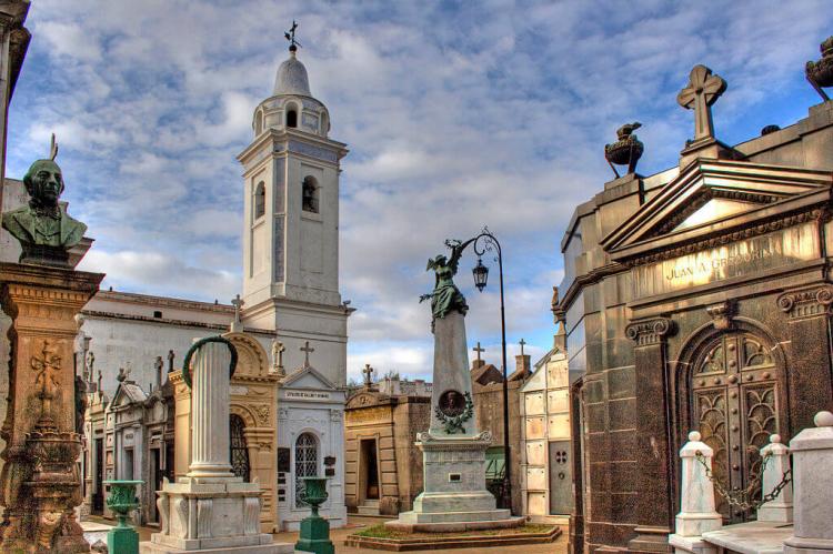 View of Recoleta Cemetery, Buenos Aires; with obelisk, bust, column and church tower; grave of Juan A Gregorini on right
