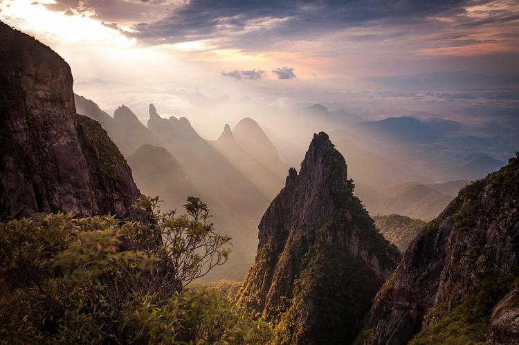 Rock formations, Dedo de Deus (God's Finger) peak in the background, Serra dos Órgãos National Park, Brazil