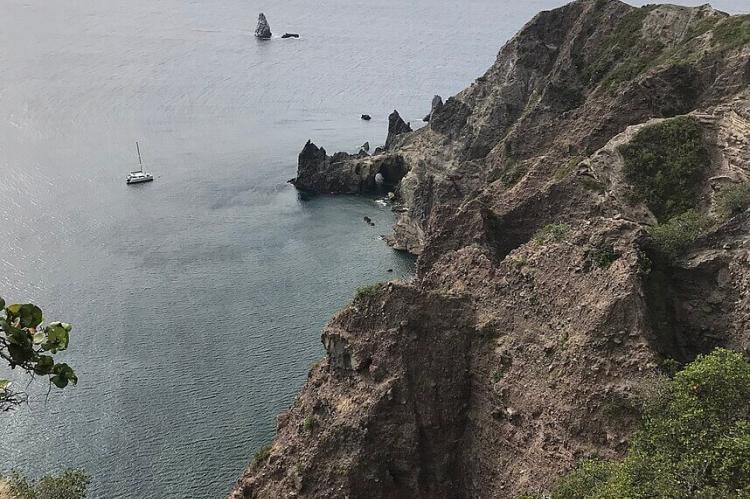 View of Wells Bay, Saba with Torrens Point and Diamond Rock in the distance