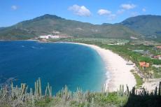 A beach in Margarita Island (Venezuela) called Playa Puerto Cruz. Hotel at the right is the Dunes Beach Resort Hotel. In the background is the Hesperia Isla Bonita Hotel. The picture was taken from the lighthouse.